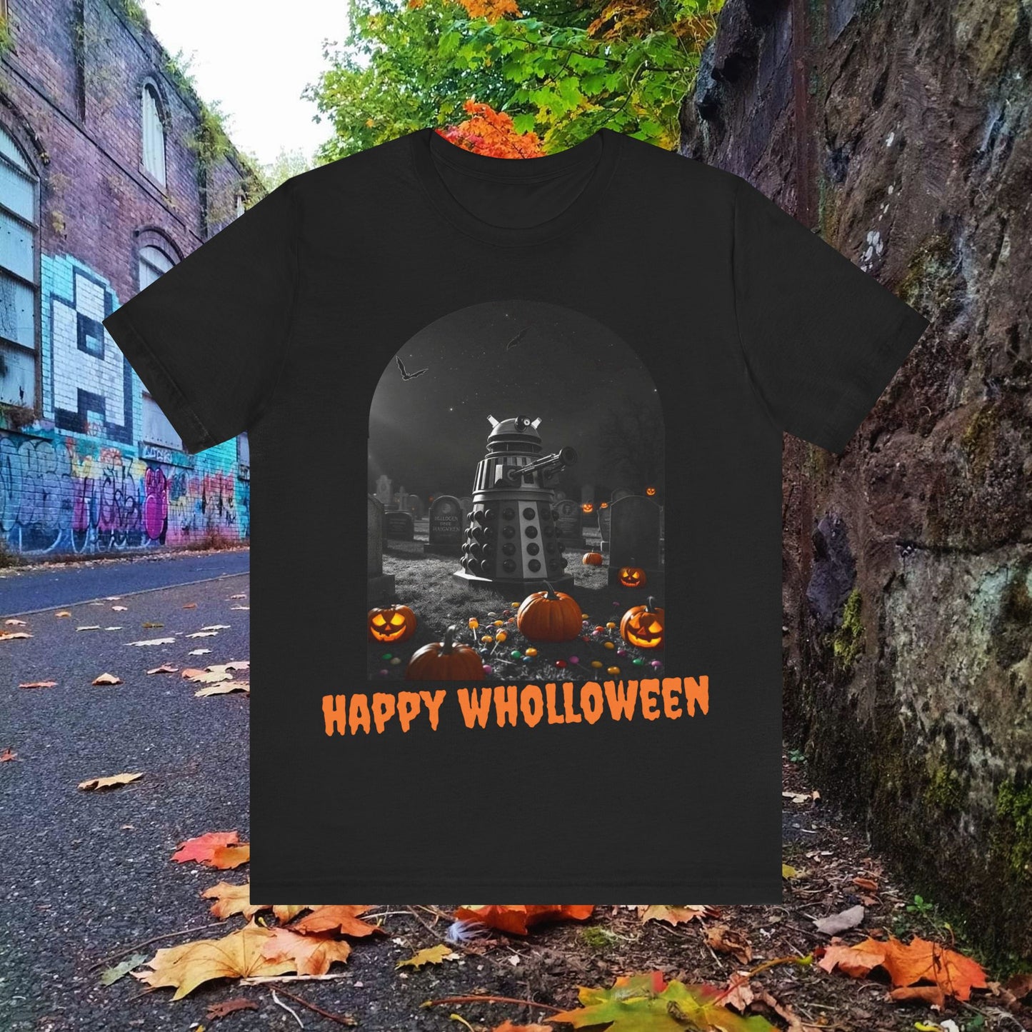 Happy Wholloween black & white Dalek with colour pumpkins in a graveyard T-shirt (Oh, and bats)